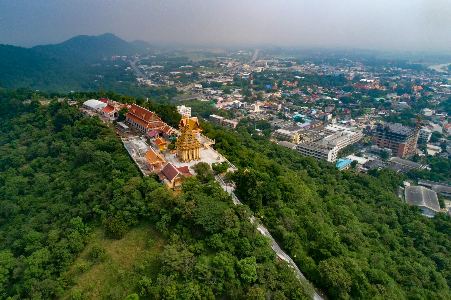 An aerial view of Wat Sangkat Rattana Khiri on Sakae Krang hill, with the town of Uthai Thani below